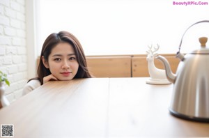 A woman sitting on a wooden bench smiling at the camera.