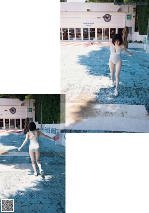 A woman in a bathing suit walking down a street.
