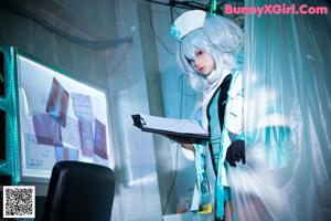 A woman in a bunny costume sitting on a table.